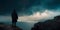 hooded figure standing on a cliff by the sea, with storm clouds and lightning in the background, suggesting a foreboding