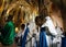 Hooded penitents entering church before the start of an easter holy week procession in mallorca