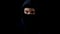Hooded serious criminal in balaclava looking at camera, piercing glance, concept