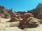 Hoodoo and window rock formations on hills in Goblin Valley