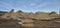 Hoodoos and well worn rock faces against a wispy blue sky