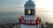 Hook Lighthouse Tower against a sunset ocean backdrop 4k