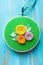 Hoop modern embroidery with botanical motifs on a wooden background