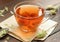 Hop herbal tea with dry herb on wooden table, natural decoction is used against insomnia, depression and for menopause and skin, h