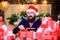 Hope for the best. Wrapped gifts with ribbons and bows. Man bearded santa claus hat celebrate new year. Hipster prepared