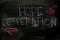 Hope or Desperation written with color chalk concept on the blackboard