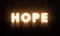 Hope Doors Concept. Glowing Hope letters On A Grungy Wall in a big Hall. Light Door Glowing Bright Letter