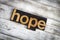 Hope Letterpress Word on Wooden Background