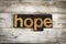 Hope Letterpress Word on Wooden Background