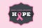 Hope text with pink ribbon and breast cancer awareness concept