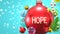 Hope and Xmas holidays, pictured as abstract Christmas ornament ball with word Hope to symbolize the connection and importance of