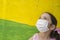 Hopeful little girl wears face mask during Covid-19 pandemic