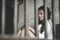 The hopeless slave girl is in a cell. Women violence and abused concept, Imprisonment, Female prisoner,  human trafficking Concept