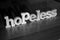 Hopeless, text words typography written with wooden letter on black background, life and business negativity