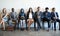 Hoping to make a memorable impression. Shot of a group of well-dressed businesspeople seated in line while waiting to be