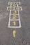 A hopscotch court painted on bitumen