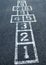 Hopscotch game on pavement at elementary school