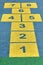 Hopscotch game in perspective in a schoolyard on an asphalt floor