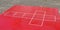 Hopscotch games layout in red wooden mat