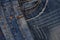 Horisontal denim background, assortment of blue jeans, pile of b