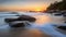 The horizon is a beautiful view, the water on the beach flows slowly, complete with sunset light and rocks in the area