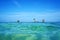 Horizon over water with islets and coconut tree