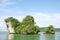 Horizon view of a big horizontal rock cliff with green vegetation, Krabi Thailand.