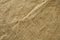 Horizontal background of burlap with white seam. Background of natural brown cloth. darkening of the edges