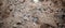 Horizontal background of industrial sand with stones