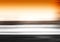 Horizontal black motion blur with orange sky background