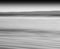 Horizontal black and white ocean milk motion blur abstraction ba