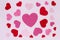 Horizontal Card Valentine`s Day. Red and pink hearts on a light pink background