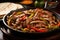 horizontal close-up of fajitas served in a sizzling skillet