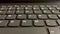 Horizontal close up shot of black laptop keyboard