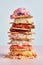 Horizontal close-up of a stack of several types of ice cream.