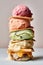 Horizontal close-up of a stack of several types of ice cream.