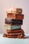 Horizontal close-up of a stack of several types of ice cream.