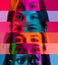 Horizontal collage of cropped multinational male and female eyes placed on narrow multicolored stripes in neon lights.