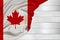 Horizontal colored national flag of modern state of Canada, beautiful silk, white wood background, concept of tourism, economy,