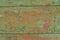 Horizontal cracks rustic green with orange wooden board for tamplate