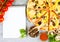 Horizontal food banner with cherry tomatoes, cutted pizza, spice and notebook on wooden background. Empty space for text.