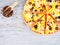 Horizontal food banner with cutted pizza, peppercorns on wooden background. Empty space for text.
