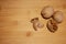 The horizontal frame. Three walnuts are lying on a bamboo Board, one is split and there is a shell next to it