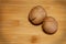 The horizontal frame. Two walnuts lie on a bamboo board