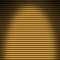 Horizontal gold tube background lit from overhead