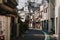 Horizontal image of a quiet Japanese street with buildings faceing each other in Tokyo