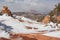 A horizontal image of windblown snow on and around the hoodoos in a little place in Southern Utah called Hoodoo city