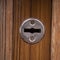 Horizontal iron keyhole on old wooden door
