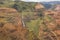 Horizontal layers in the rocks lead to Waimea Falls