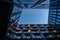 Horizontal low-angle shot of a modern glassy building in Zurich with its mirror reflection